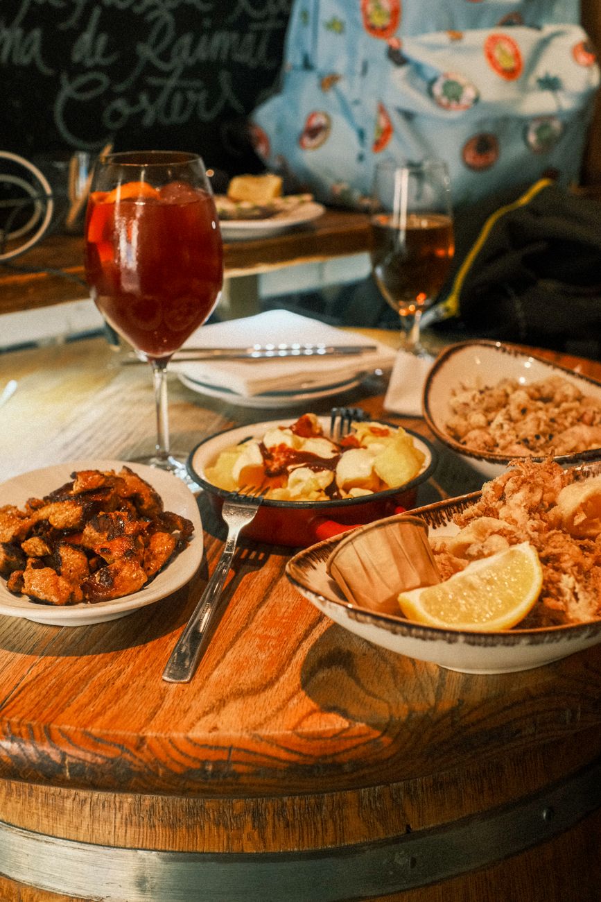 Plate of fresh grilled fish and pintxos in Basque bistro